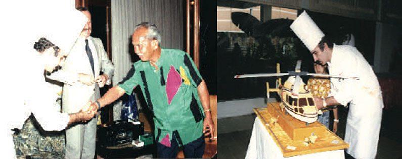 Just before presenting the Malaysian King Iskandar with a helicopter birthday cake.