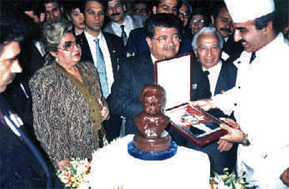 Receiving an autographed picture from the Turkish Prime Minister Turgut Ozal