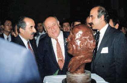 Presenting a chocolate bust of Turkish President Demirel to himself.